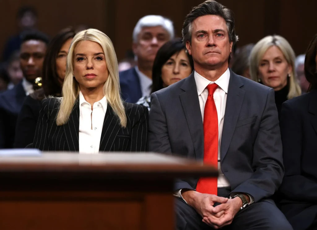 Pam Bondi and John Wakefield sit together during Pam Bondi’s confirmation hearing before the Senate Judiciary Committee in Washington, D.C.