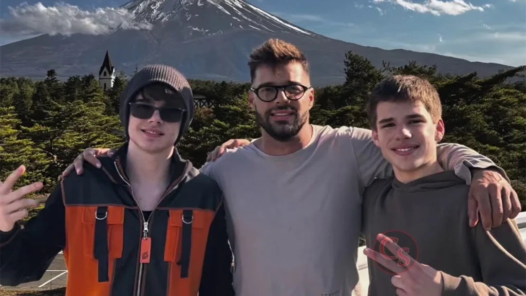 Alt Text
Valentino Martin and his brother Matteo Martin pose together with a man in front of a snow-capped mountain in Iceland.