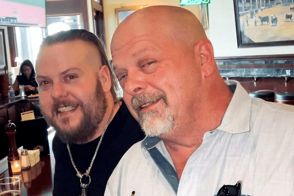 Adam Harrison and Rick Harrison smiling together at a restaurant