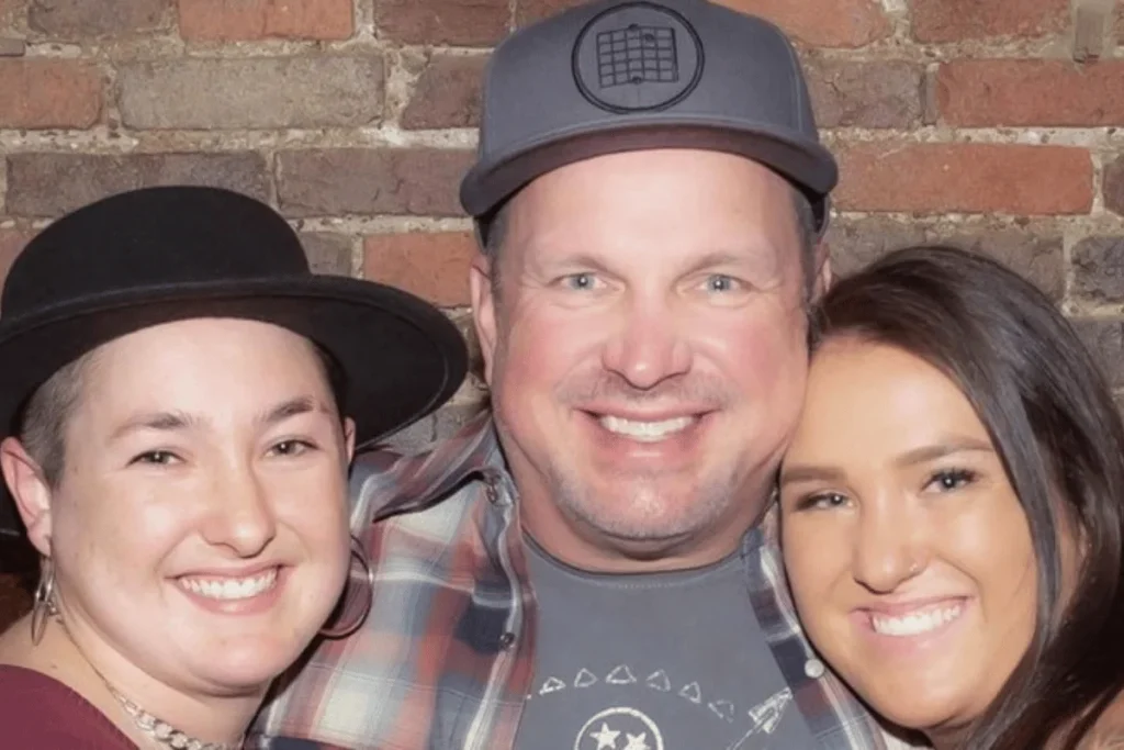 August Anna Brooks with her father Garth Brooks and sister Allie Colleen Brooks