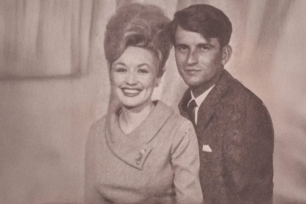 Vintage archival portrait of a young Carl Dean and Dolly Parton together during the early years of their relationship.