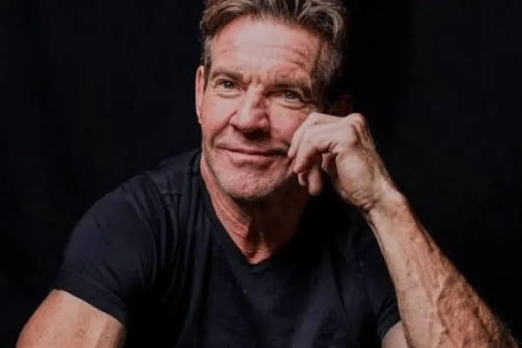 Close-up portrait of Dennis Quaid wearing a dark shirt