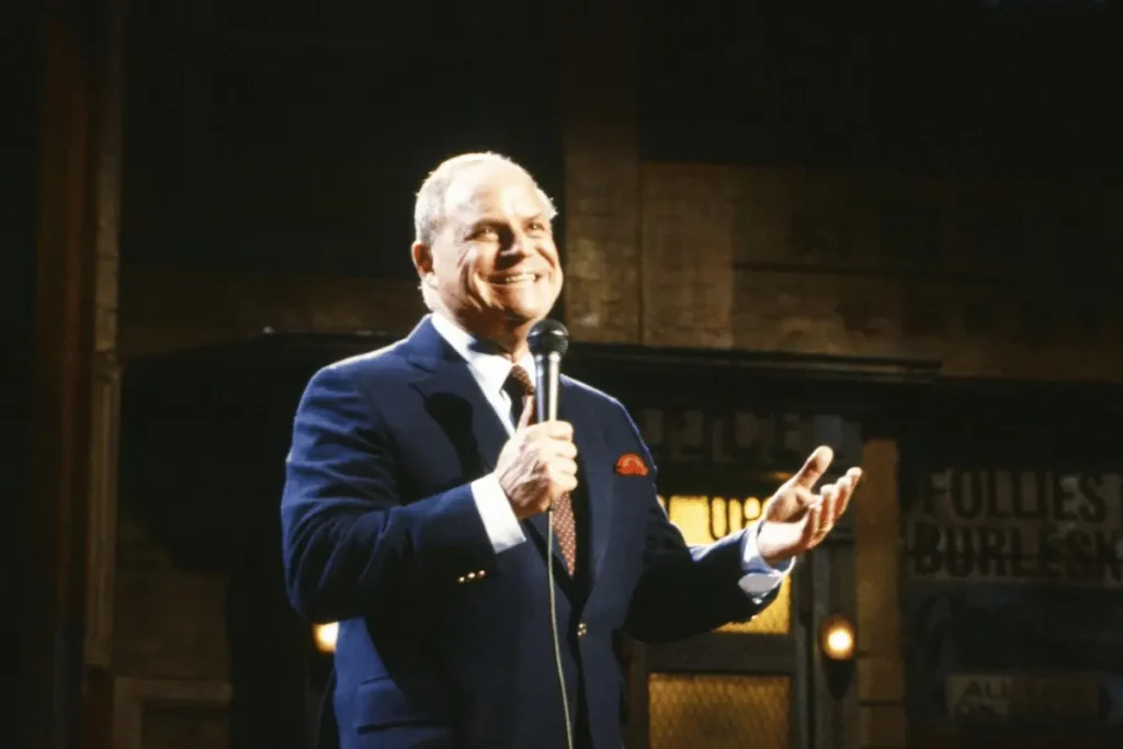 his celebrated career as one of America's best-known insult comedians.
Don Rickles performing stand-up comedy with a microphone on stage