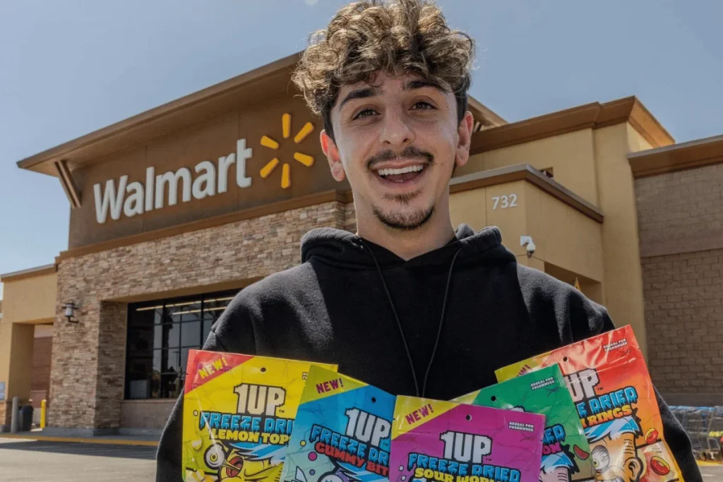 FaZe Rug holding 1UP Candy products outside a Walmart store