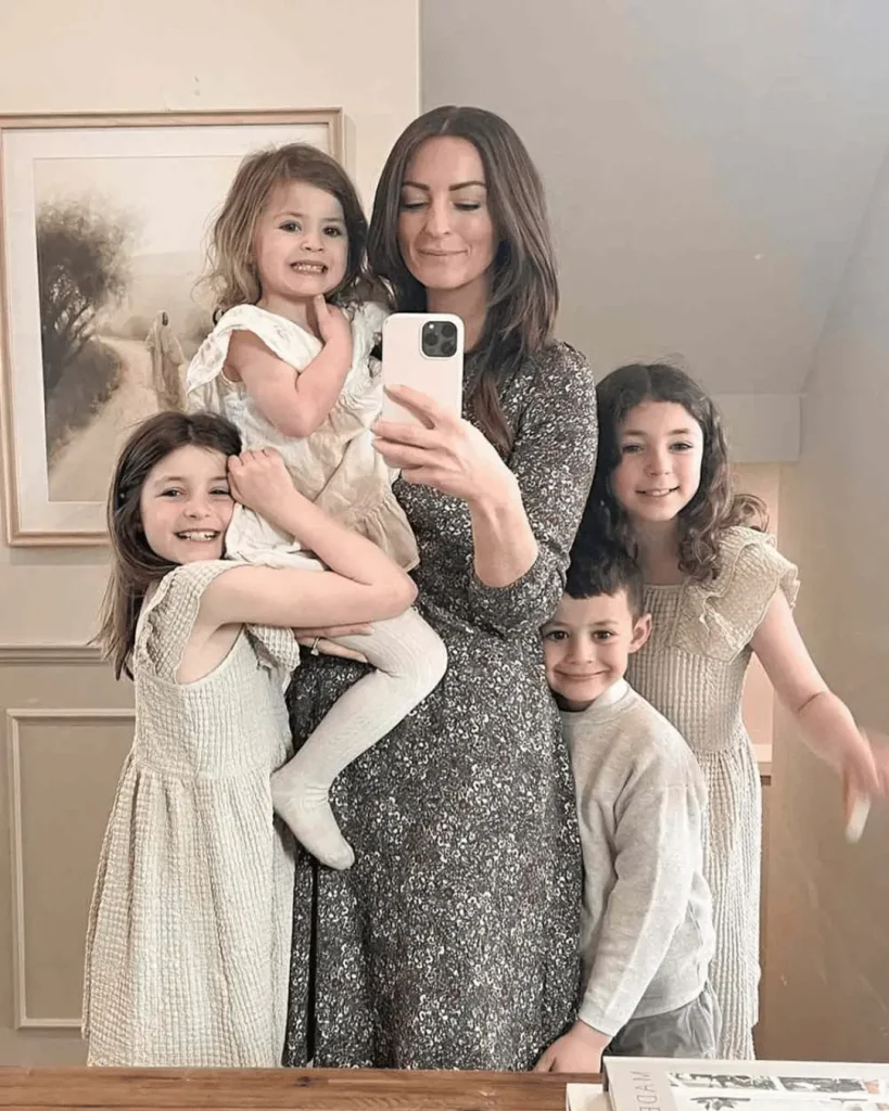 Melissa Mae Carlton posing with her children in a family portrait