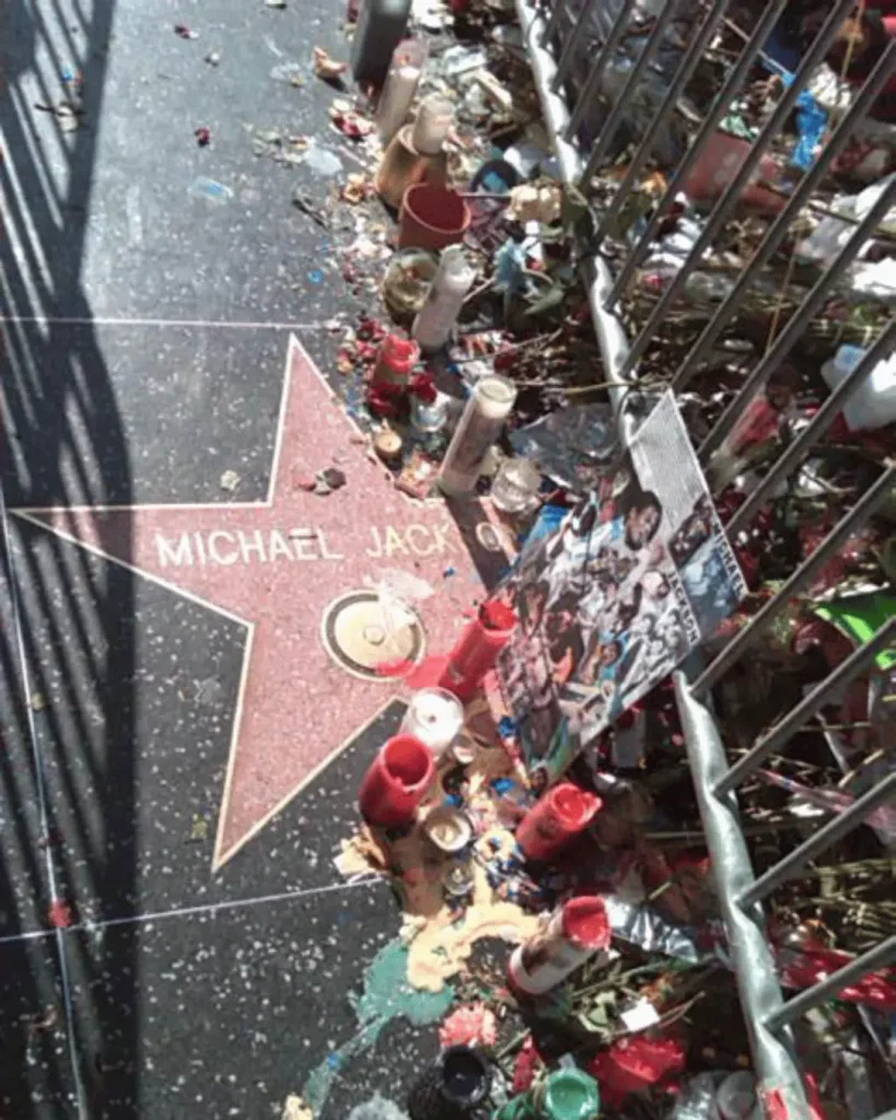 Michael Jackson's Hollywood Walk of Fame star surrounded by flowers and tributes after his death in 2009.