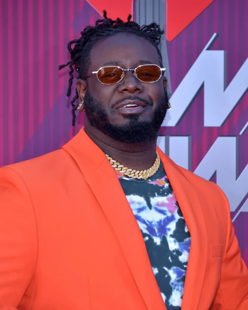 T-Pain wearing an orange suit at a public appearance during his successful entertainment career