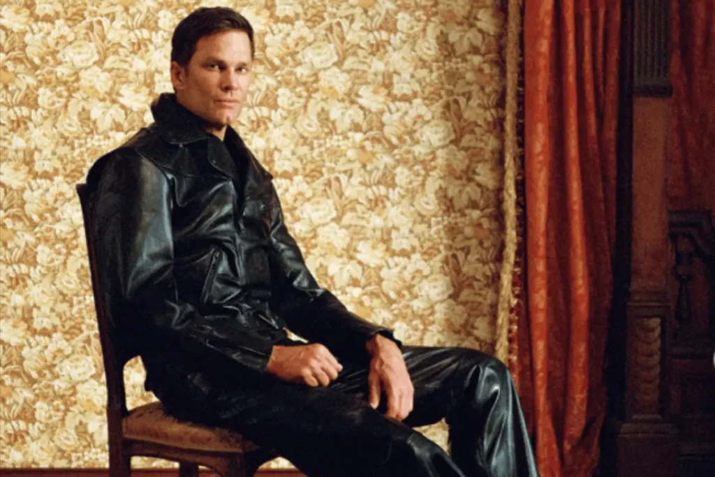 Tom Brady wearing a black leather outfit in an early portrait