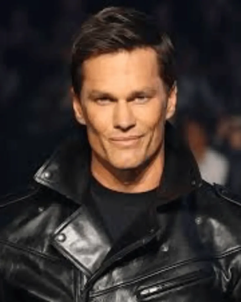 Tom Brady wearing a black leather jacket in an early portrait