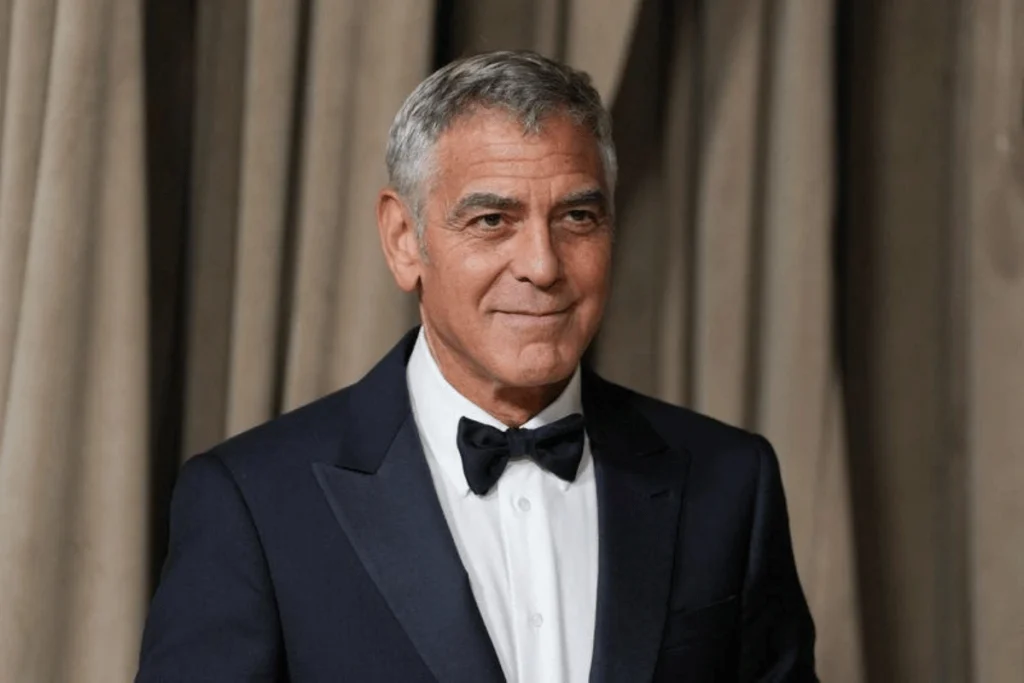 George Clooney smiling at a film premiere in 2025.