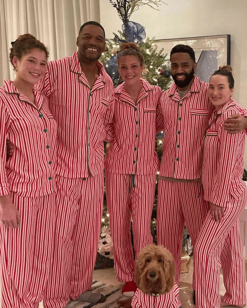 Michael Strahan with Kayla Quick and family members in matching pajamas