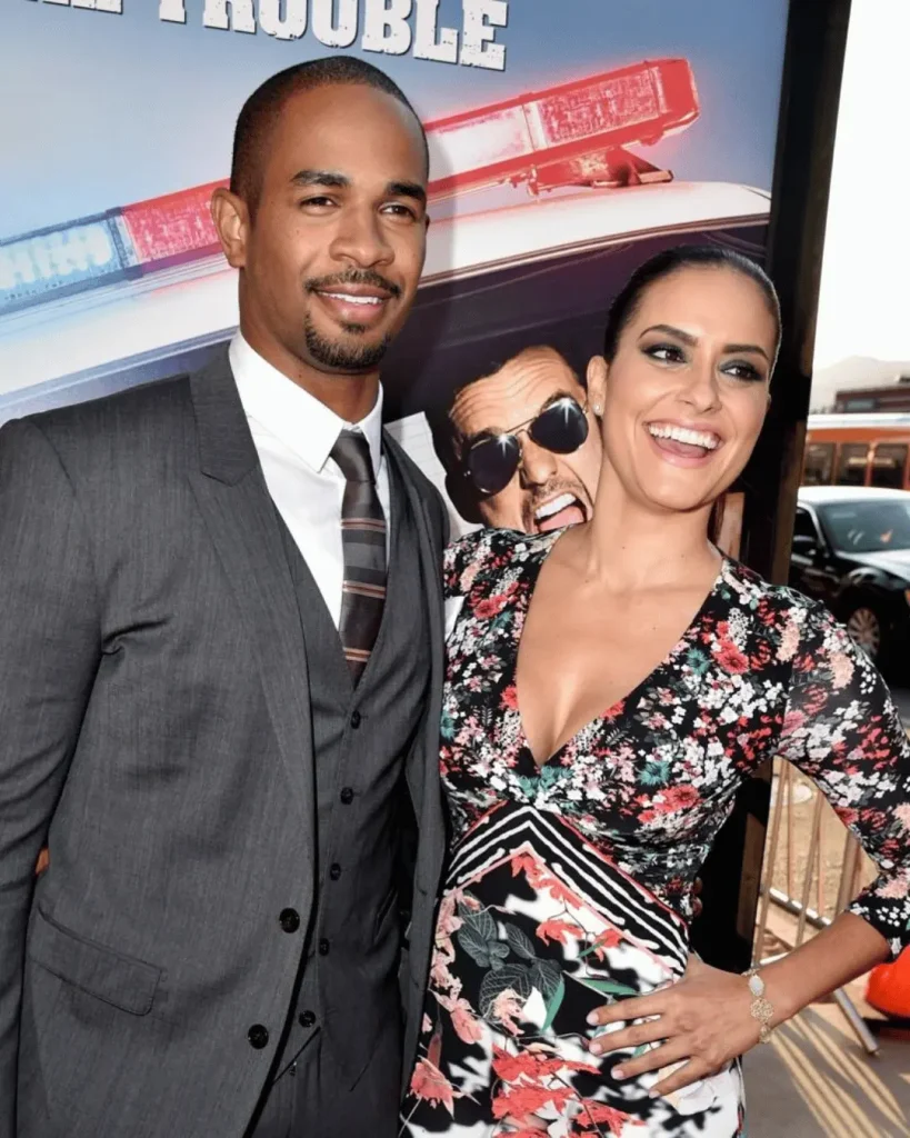 Samara Saraiva and Damon Wayans Jr. posing together at the 2014 Let's Be Cops premiere.
